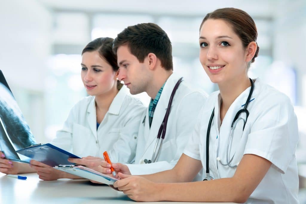 Group of medical students studying in classroom