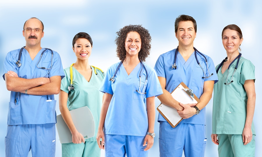 Smiling medical people with stethoscopes. Doctors and nurses